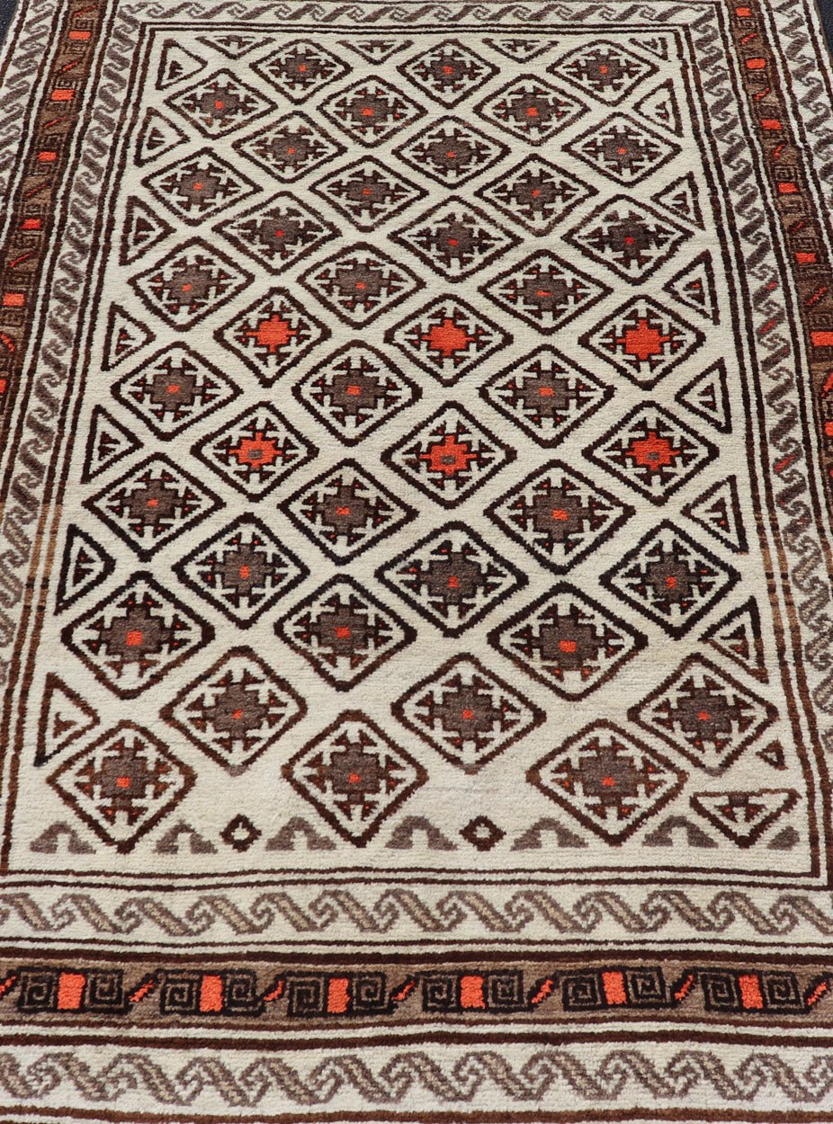 Antique Hand - Knotted Baluch Tribal Rug with All - Over Geometric Diamond Design. Keivan Woven Arts, rug EMB - 9679 - P13559; country of origin / type: Iran / Baluch, circa 1930s. This Antique Baluch Rug has been hand - knotted and features an impressive... - Keivan Woven ArtsEMB - 9679 - P13559 - 16241Rug
