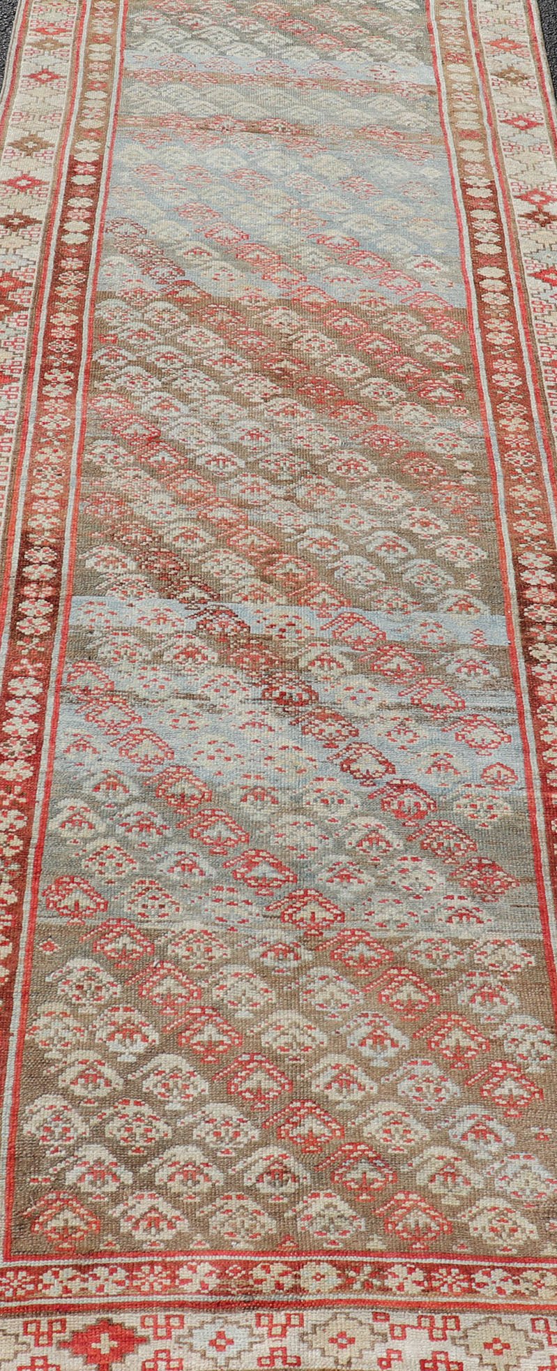 Antique Kurdish Runner in Soft Tones in Wool with Sub - Geometric Paisley Design. Keivan Woven Arts / rug EMB - 9682 - P13585, country of origin / type: Iran / kurdish, circa 1900. This antique Persian Kurdish runner has been hand - knotted in wool and ... - Keivan Woven ArtsEMB - 9682 - P13585 - 16265Rug