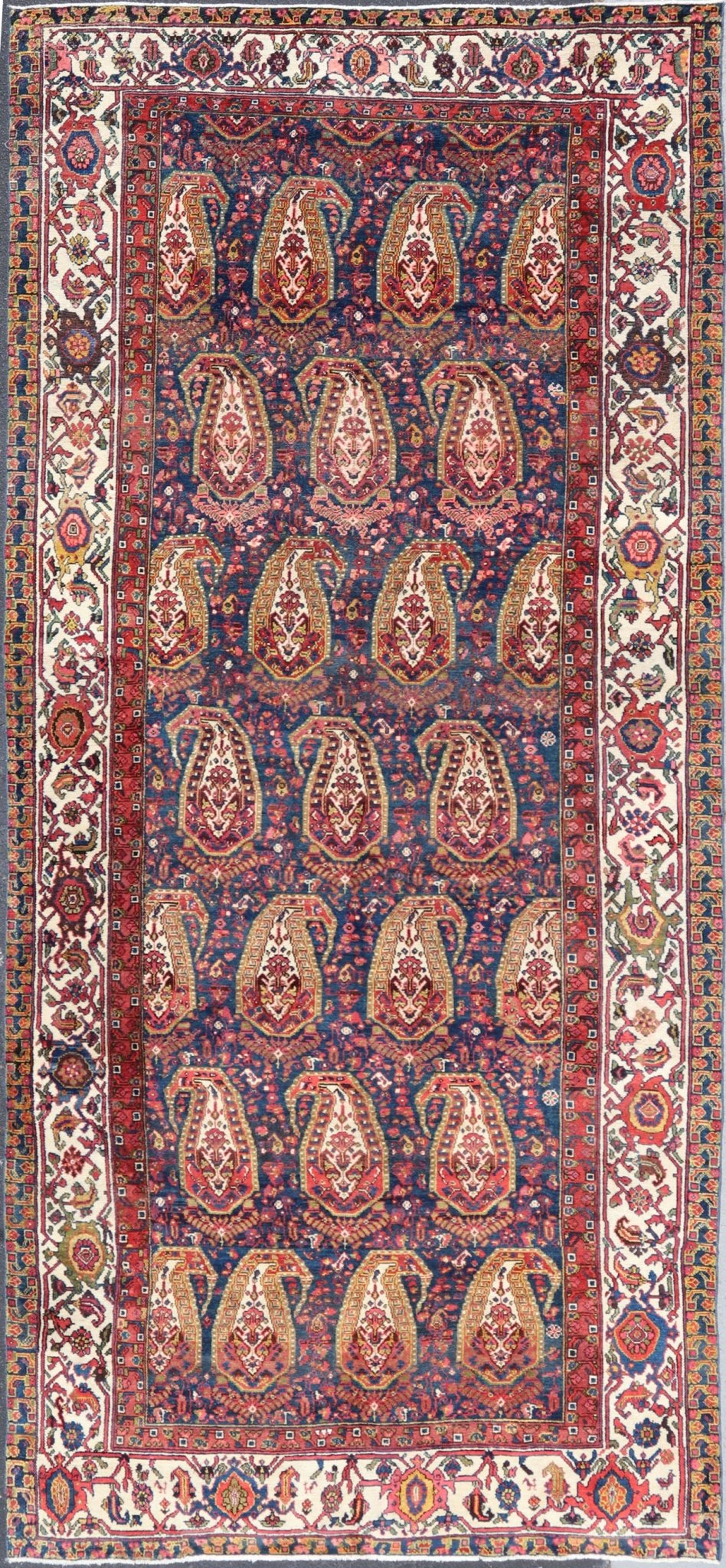 Antique Persian Paisley Field Hamadan in Multi - Tiered Border in Red and Blue This unique Persian Hamadan features a dark blue background placed behind a sub - geometric, red and mustard paisley design. The boldened border highlights ivory between... - Keivan Woven ArtsEMB - 9683 - P13868 - 16271Rug