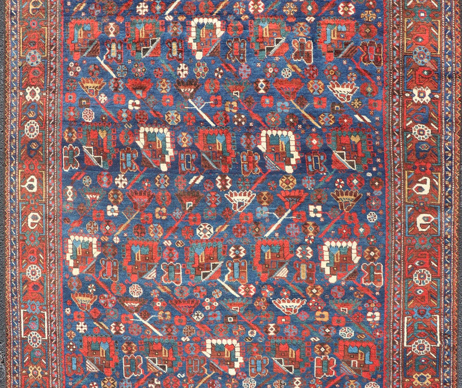Antique Persian Qashqai Shiraz Tribal Rug with All - Over Tribal Design Antique Persian Qashqai Shiraz Tribal Rug with Tribal Design in jewel tones with blue background. Keivan Woven Arts / rug EMB - 9687 - P13529, country of origin / type: Iran / Qas... - Keivan Woven ArtsEMB - 9687 - P13529 - 16289Rug