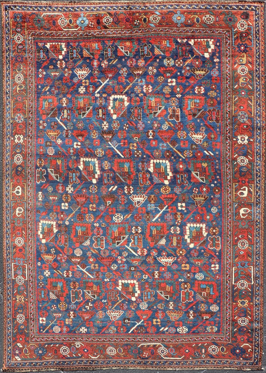 Antique Persian Qashqai Shiraz Tribal Rug with All - Over Tribal Design Antique Persian Qashqai Shiraz Tribal Rug with Tribal Design in jewel tones with blue background. Keivan Woven Arts / rug EMB - 9687 - P13529, country of origin / type: Iran / Qas... - Keivan Woven ArtsEMB - 9687 - P13529 - 16289Rug