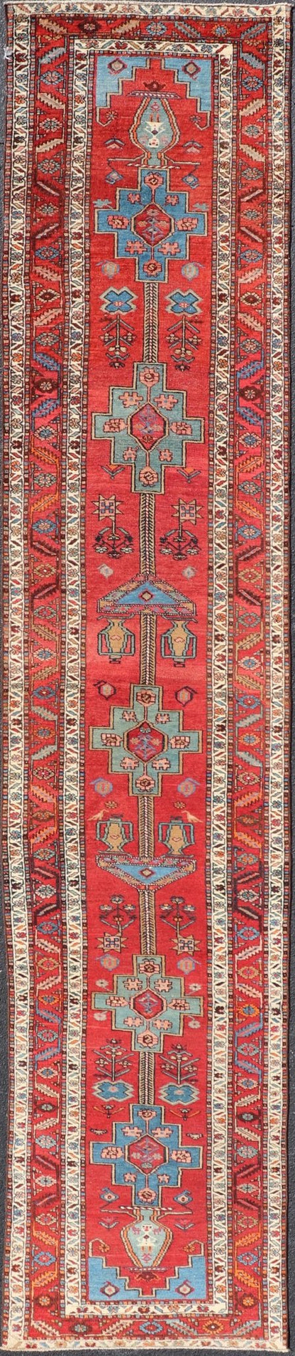 Antique Persian Long Persian Serapi Runner in Wool with Medallion Design This antique Persian Serapi rug was hand - knotted in wool and features a sub - geometric medallion design rendered in multicolor. A complementary, multi - tiered border encompas... - Keivan Woven ArtsEMB - 9691 - P13533 - 16313Rug