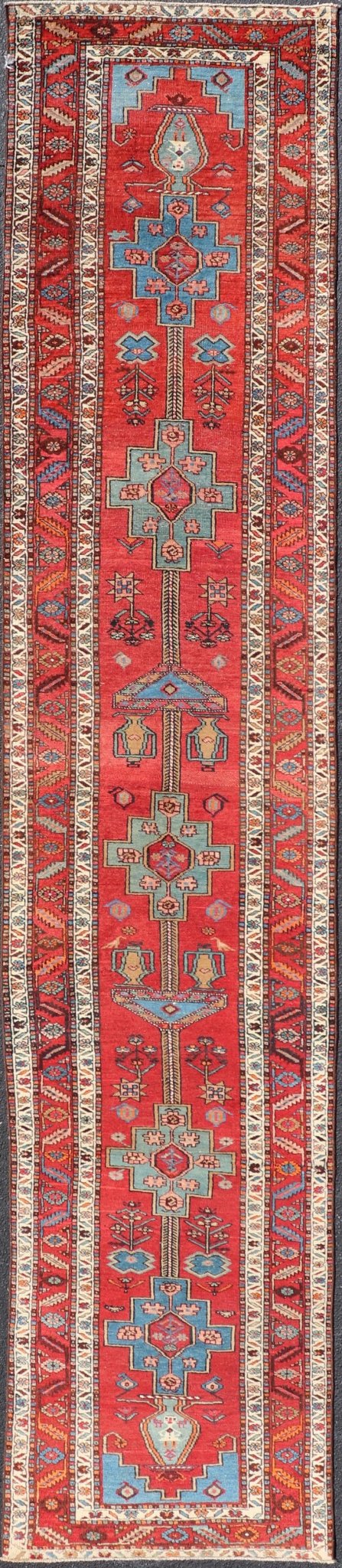 Antique Persian Long Persian Serapi Runner in Wool with Medallion Design This antique Persian Serapi rug was hand - knotted in wool and features a sub - geometric medallion design rendered in multicolor. A complementary, multi - tiered border encompas... - Keivan Woven ArtsEMB - 9691 - P13533 - 16313Rug