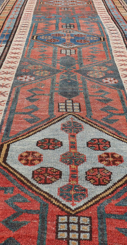 Antique Colorful Persian Heriz - Serapi Runner with a Bold Geometric Design Antique Colorful Persian Heriz - Serapi Runner with a Bold Geometric Design, Keivan Woven Arts / Rug/EMB - 9693 - P13532 Made in the early 20th century, this charming Heriz - ... - Keivan Woven ArtsEMB - 9693 - P13532 - 16319Rug