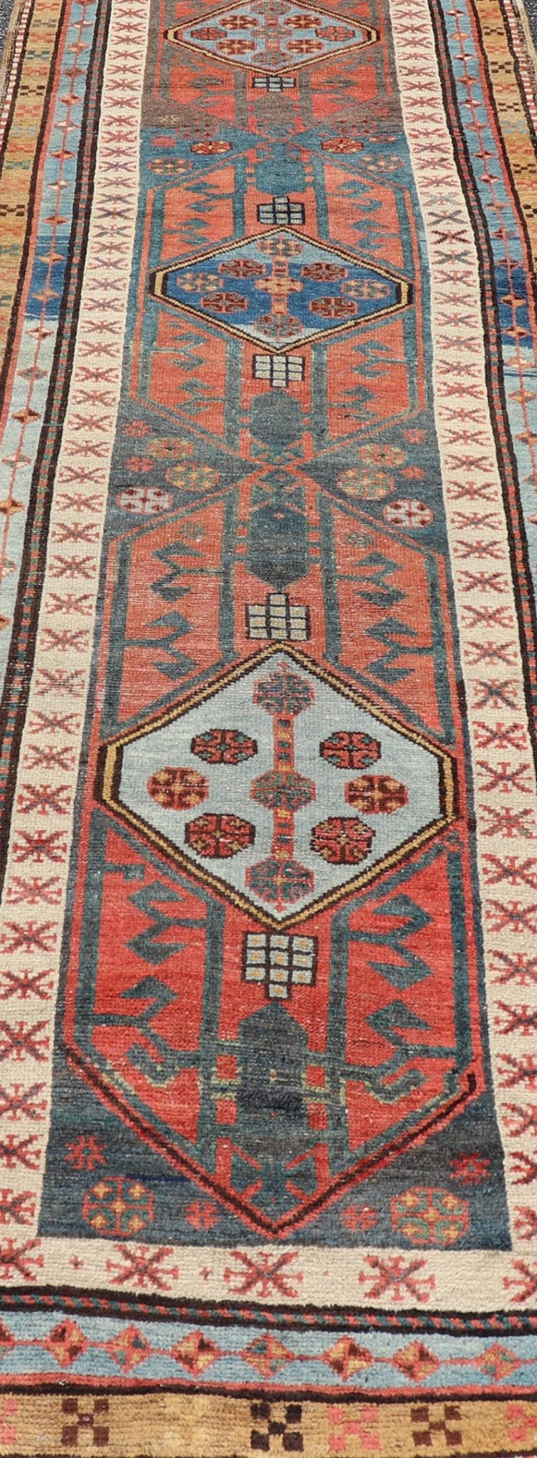 Antique Colorful Persian Heriz - Serapi Runner with a Bold Geometric Design Antique Colorful Persian Heriz - Serapi Runner with a Bold Geometric Design, Keivan Woven Arts / Rug/EMB - 9693 - P13532 Made in the early 20th century, this charming Heriz - ... - Keivan Woven ArtsEMB - 9693 - P13532 - 16319Rug