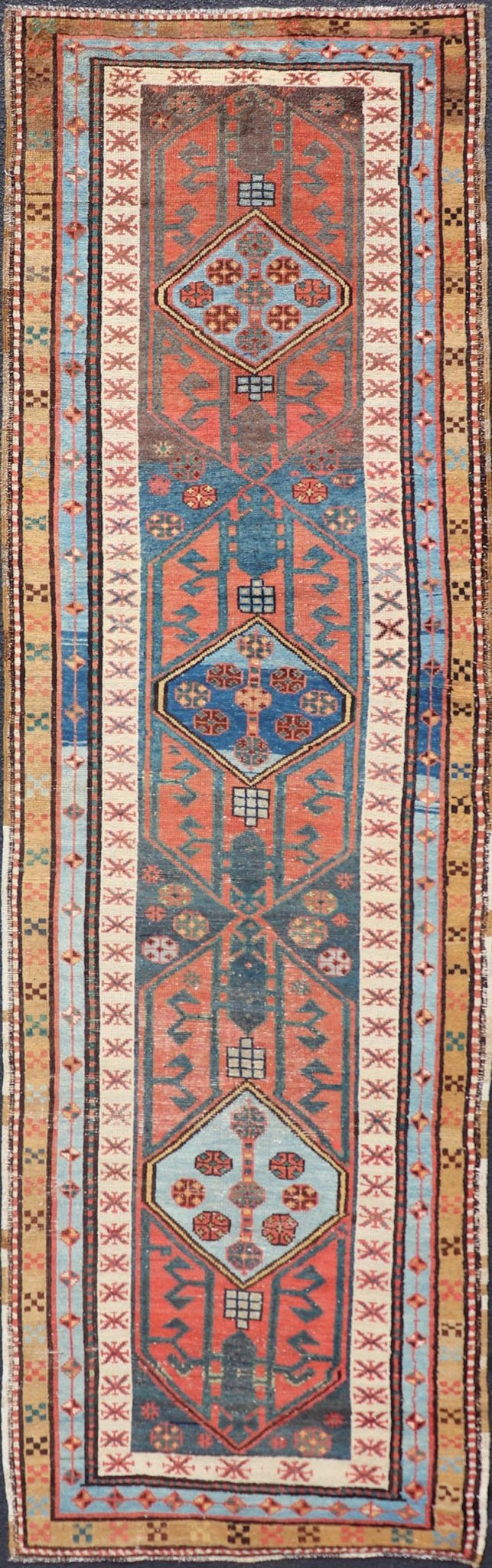 Antique Colorful Persian Heriz - Serapi Runner with a Bold Geometric Design Antique Colorful Persian Heriz - Serapi Runner with a Bold Geometric Design, Keivan Woven Arts / Rug/EMB - 9693 - P13532 Made in the early 20th century, this charming Heriz - ... - Keivan Woven ArtsEMB - 9693 - P13532 - 16319