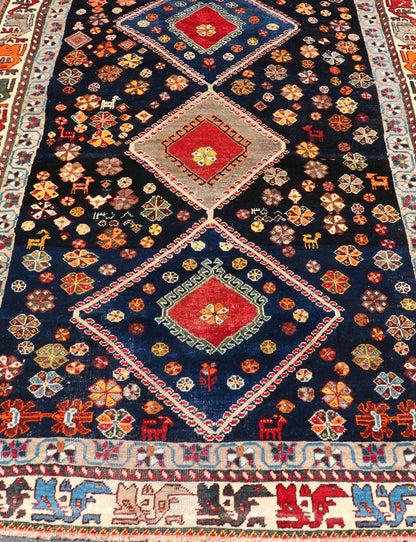 Vintage Persian Tribal Shiraz with Medallion Design on Dark Background This vintage Persian Shiraz features a rich navy blue background under the centered red medallions, edged with green, gold, taupe, maroon, pinks and reds. Paired with ea... - Keivan Woven ArtsEMB - 9694 - P13894 - 16510Rug