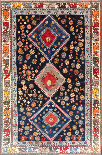 Vintage Persian Tribal Shiraz with Medallion Design on Dark Background This vintage Persian Shiraz features a rich navy blue background under the centered red medallions, edged with green, gold, taupe, maroon, pinks and reds. Paired with ea... - Keivan Woven ArtsEMB - 9694 - P13894 - 16510Rug