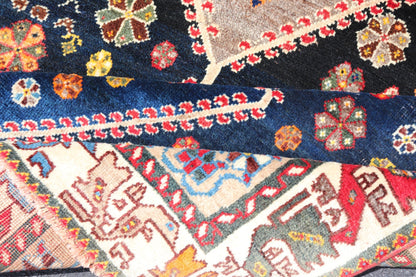 Vintage Persian Tribal Shiraz with Medallion Design on Dark Background This vintage Persian Shiraz features a rich navy blue background under the centered red medallions, edged with green, gold, taupe, maroon, pinks and reds. Paired with ea... - Keivan Woven ArtsEMB - 9694 - P13894 - 16510Rug