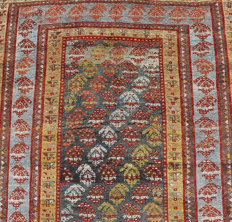 Antique Persian Hand - Knotted Kurdish Runner in Wool with Sub - Geometric Design This antique Persian Kurdish runner has been hand - knotted in wool and features an all - over sub - geometric design rendered in multicolor. A complementary, multi - tiered... - Keivan Woven ArtsEMB - 9698 - P13888 - 16540Rug