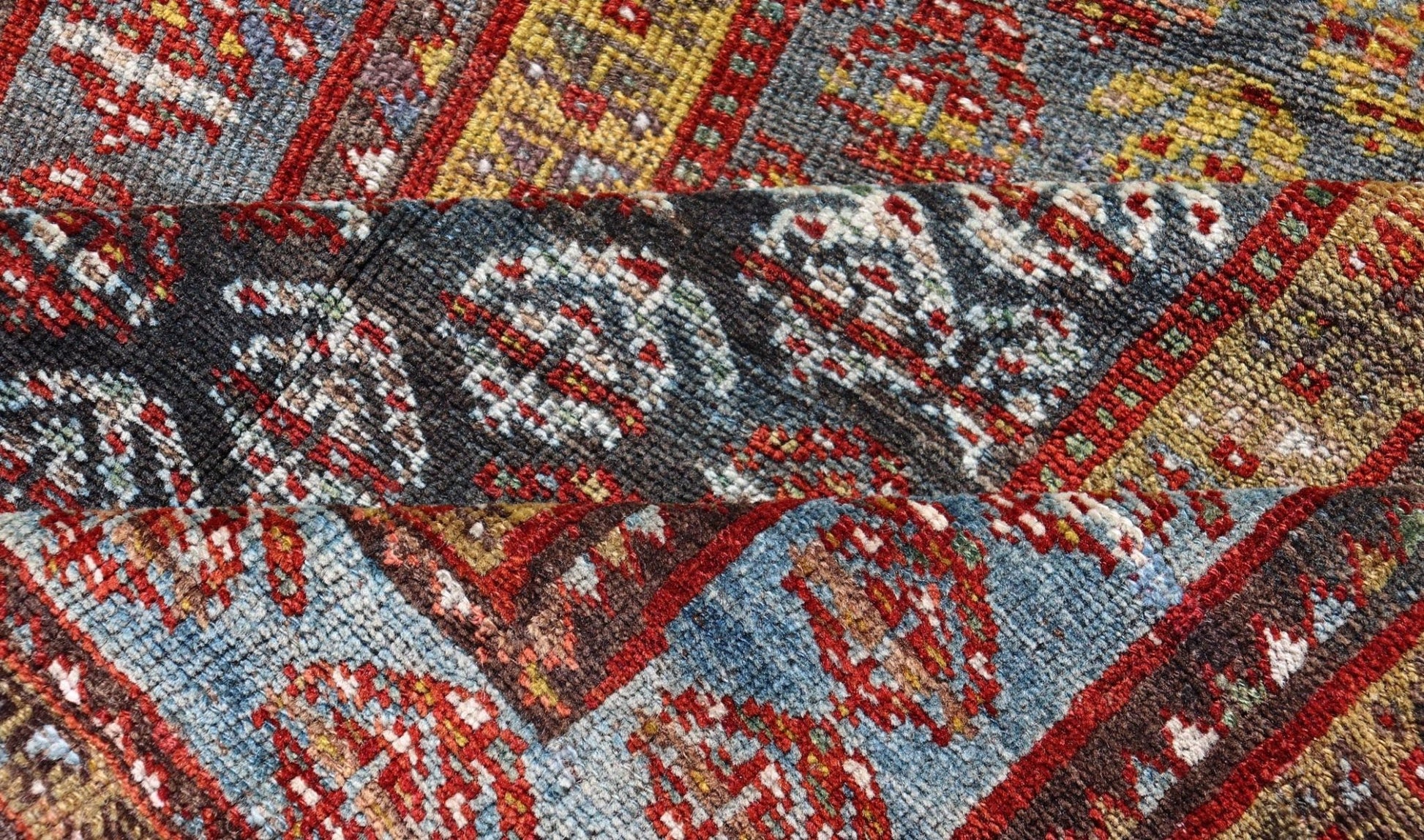 Antique Persian Hand - Knotted Kurdish Runner in Wool with Sub - Geometric Design This antique Persian Kurdish runner has been hand - knotted in wool and features an all - over sub - geometric design rendered in multicolor. A complementary, multi - tiered... - Keivan Woven ArtsEMB - 9698 - P13888 - 16540Rug