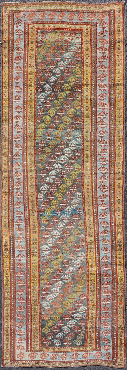 Antique Persian Hand - Knotted Kurdish Runner in Wool with Sub - Geometric Design This antique Persian Kurdish runner has been hand - knotted in wool and features an all - over sub - geometric design rendered in multicolor. A complementary, multi - tiered... - Keivan Woven ArtsEMB - 9698 - P13888 - 16540Rug