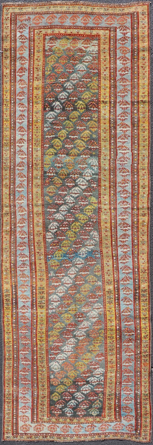 Antique Persian Hand - Knotted Kurdish Runner in Wool with Sub - Geometric Design This antique Persian Kurdish runner has been hand - knotted in wool and features an all - over sub - geometric design rendered in multicolor. A complementary, multi - tiered... - Keivan Woven ArtsEMB - 9698 - P13888 - 16540Rug