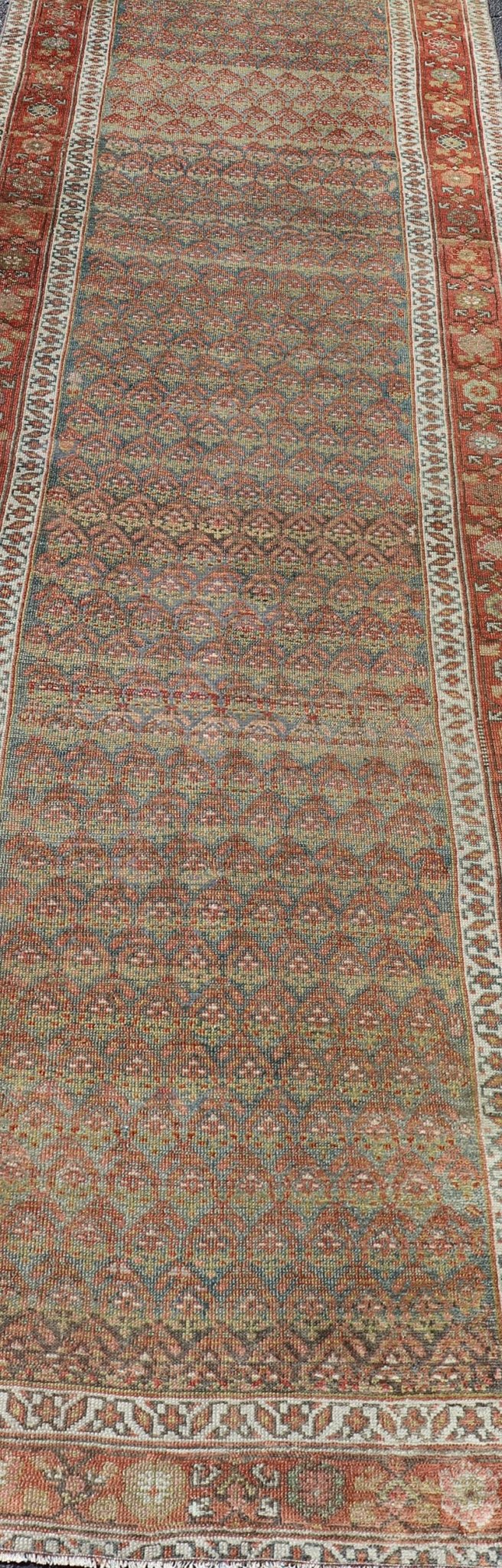 Antique Persian Hamadan Gallery Runner in Wool with All - Over Tribal Design Measures: 3'6 x 12'8 This antique Persian Hamadan rug has been hand - knotted in wool and features an all - over sub - geometric design rendered in red's, pink, green, ... - Keivan Woven ArtsEMB - 9700 - P13882 - 16552Rug