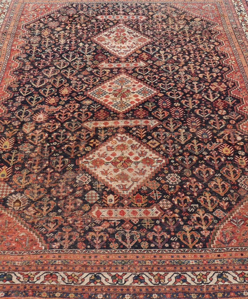 Measures: 7'1 x 9'9 Antique Persian Shiraz with All - Over Medallion Design in Ink Blue and Red. Keivan Woven Arts; rug EMB - 9703 - 13459, country of origin / type: Iran / Shiraz, circa 1920. This antique Persian Shiraz rug has been hand - knotted ... - Keivan Woven ArtsEMB - 9703 - 13459 - 16430Rug