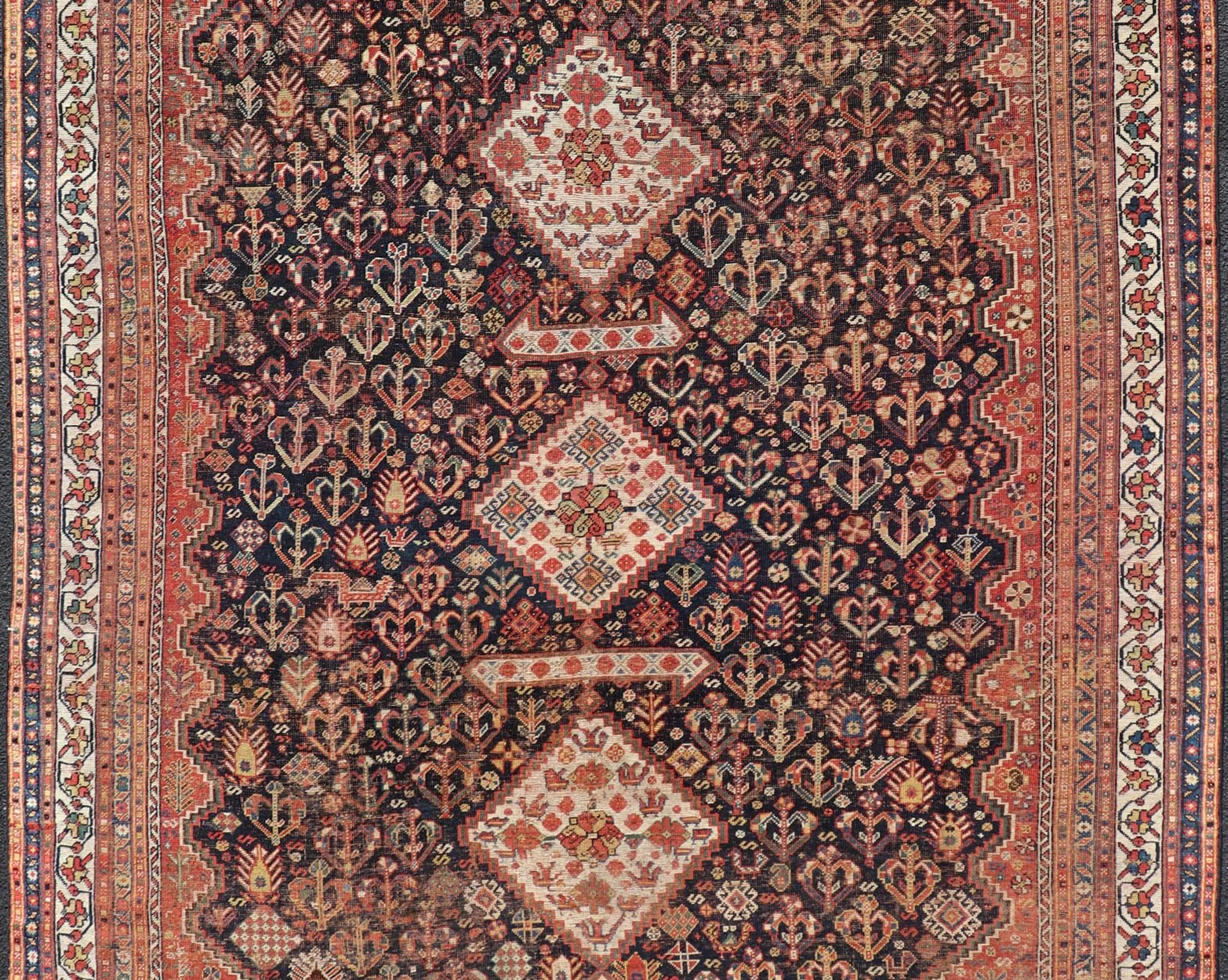 Measures: 7'1 x 9'9 Antique Persian Shiraz with All - Over Medallion Design in Ink Blue and Red. Keivan Woven Arts; rug EMB - 9703 - 13459, country of origin / type: Iran / Shiraz, circa 1920. This antique Persian Shiraz rug has been hand - knotted ... - Keivan Woven ArtsEMB - 9703 - 13459 - 16430Rug