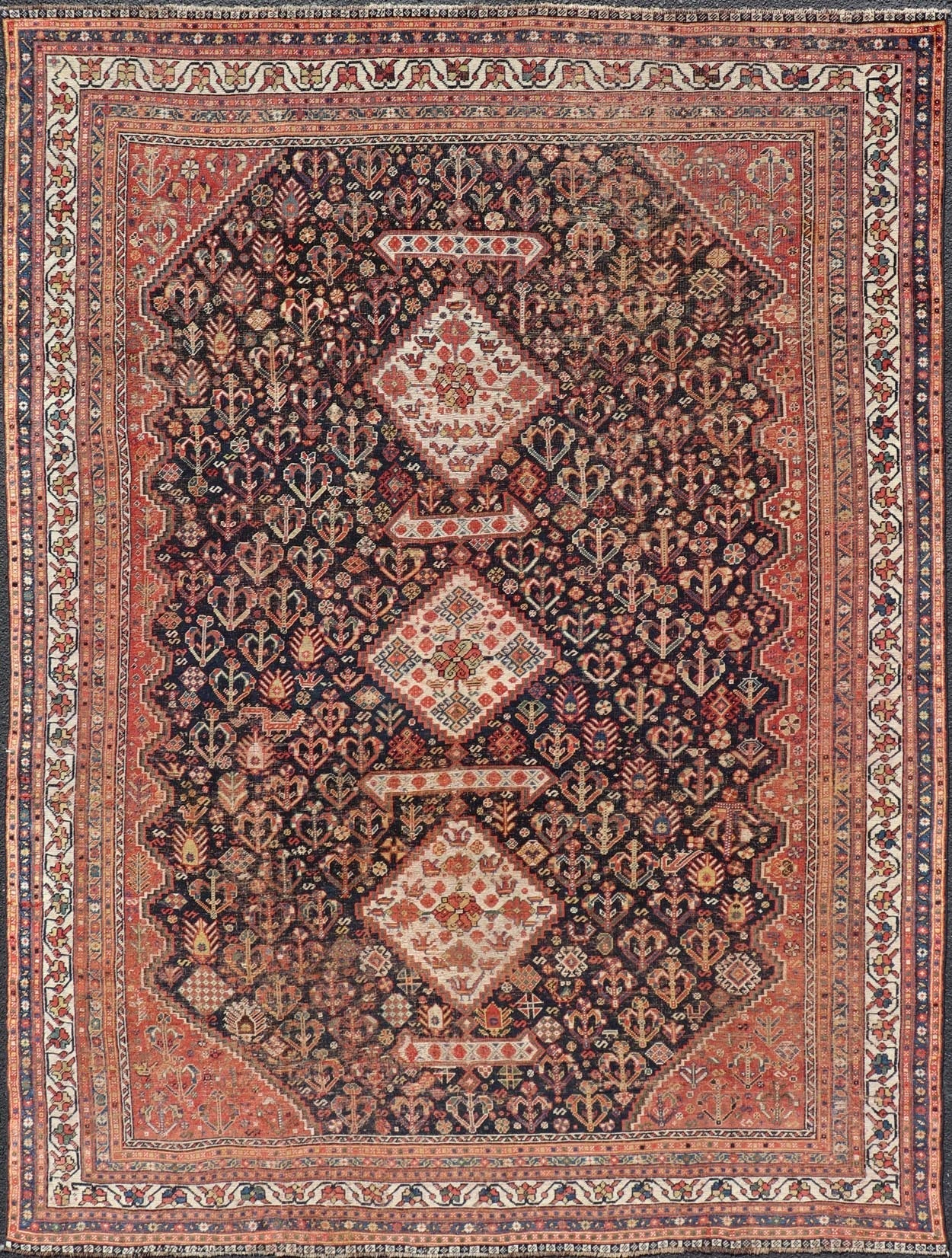 Measures: 7'1 x 9'9 Antique Persian Shiraz with All - Over Medallion Design in Ink Blue and Red. Keivan Woven Arts; rug EMB - 9703 - 13459, country of origin / type: Iran / Shiraz, circa 1920. This antique Persian Shiraz rug has been hand - knotted ... - Keivan Woven ArtsEMB - 9703 - 13459 - 16430