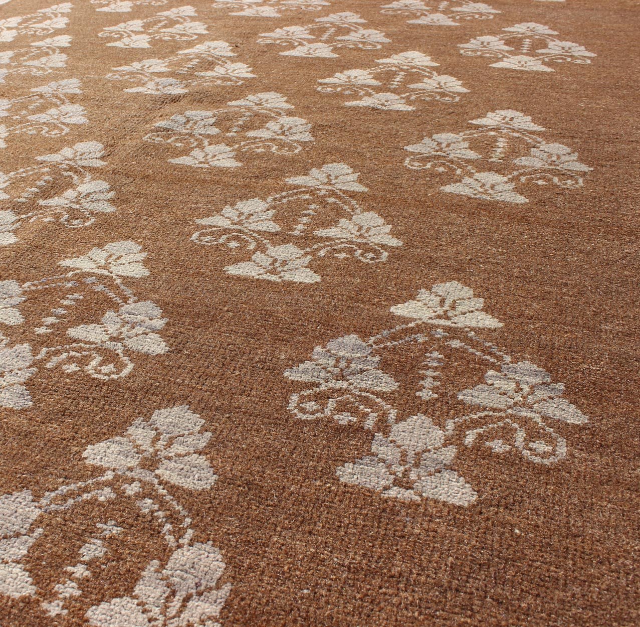 Vintage Turkish unique Oushak with Repeating Flowers Design. Measures: 4'6 x 6'10. This Vintage Oushak displays a chocolate brown background with Taupe/grey repeating motifs in the central field, all flanked by a surrounding solid border in Taupe... - Keivan Woven ArtsEN - 1005 - 3425Rug