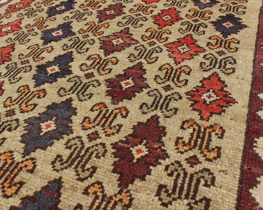 Colorful Midcentury Turkish Tulu Rug with Repeating Design Set on Wheat Field kwarugs Colorful midcentury Turkish Tulu rug with Repeating design set on wheat field, rug en - 1023, country of origin type: Turkey Oushak, circa 1950. This Tulu... - Keivan Woven ArtsEN - 1023 - 4462Rug