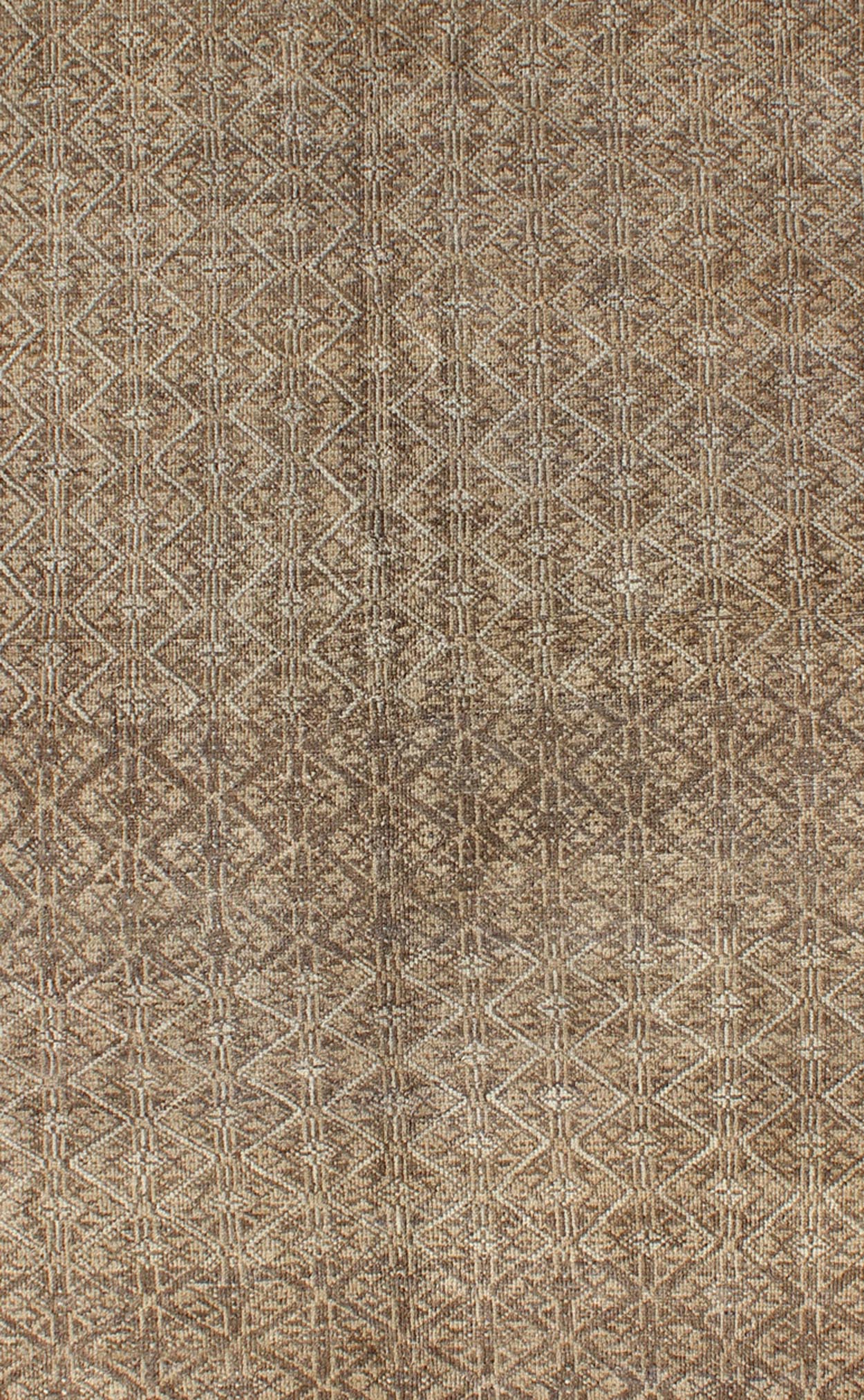 Rare Turkish Rug with Brown and Neutral Colors This piece is an impressive patterned and geometric rug that was handwoven during the first part of the 20th Century in Turkey. With an all - over diamond and lattice design, the color palette and des... - Keivan Woven ArtsEN - 1085 - 5448Rug