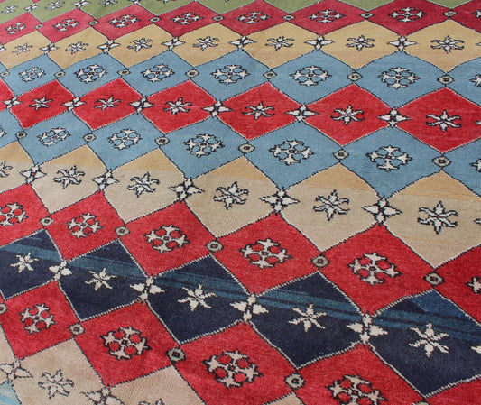 Mid - Century Rug Rendered with a multi - colored background and a spotted and speckled assortment of yellow, blue, green, red and brown colors, this very unique Mid Century rug has diamonds shapes that vary in color. Measures: 6`6 x 9` - Keivan Woven ArtsEN - 11037 - 5275Rug