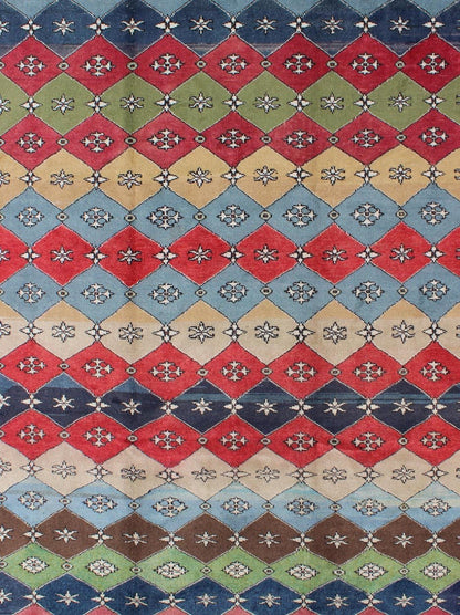 Mid - Century Rug Rendered with a multi - colored background and a spotted and speckled assortment of yellow, blue, green, red and brown colors, this very unique Mid Century rug has diamonds shapes that vary in color. Measures: 6`6 x 9` - Keivan Woven ArtsEN - 11037 - 5275Rug