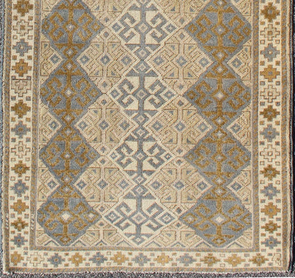 Antique Turkish Oushak Runner with Symmetrical Geometric Design Measures: 3'3 X 9'11. This rug is composed of alternating diamond motifs in different colorations that make the design more unique. The piece features, Gray blue, Camel, brown, cream... - Keivan Woven ArtsEN - 112619 - 2942Rug