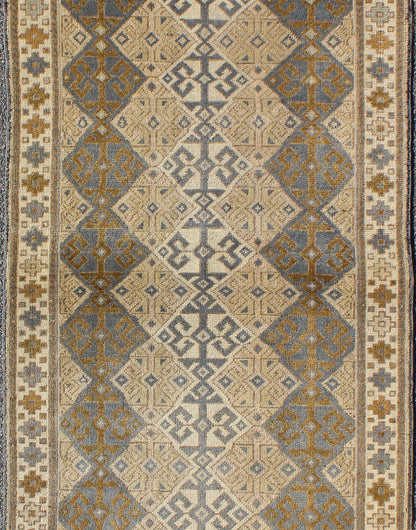 Antique Turkish Oushak Runner with Symmetrical Geometric Design Measures: 3'3 X 9'11. This rug is composed of alternating diamond motifs in different colorations that make the design more unique. The piece features, Gray blue, Camel, brown, cream... - Keivan Woven ArtsEN - 112619 - 2942Rug
