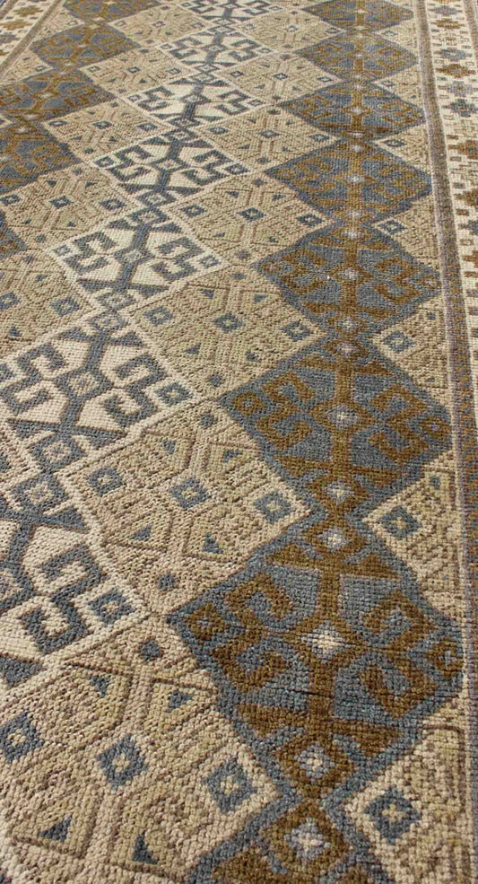 Antique Turkish Oushak Runner with Symmetrical Geometric Design Measures: 3'3 X 9'11. This rug is composed of alternating diamond motifs in different colorations that make the design more unique. The piece features, Gray blue, Camel, brown, cream... - Keivan Woven ArtsEN - 112619 - 2942Rug