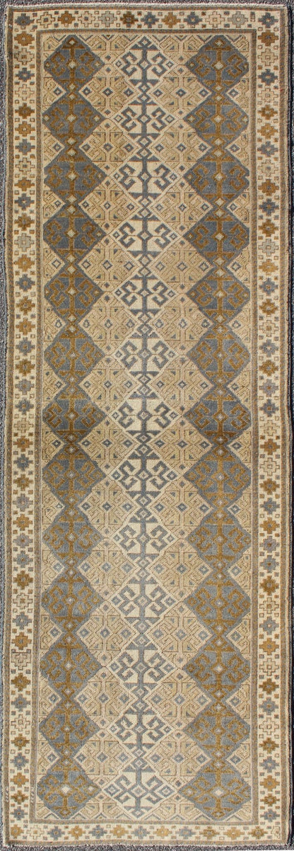 Antique Turkish Oushak Runner with Symmetrical Geometric Design Measures: 3'3 X 9'11. This rug is composed of alternating diamond motifs in different colorations that make the design more unique. The piece features, Gray blue, Camel, brown, cream... - Keivan Woven ArtsEN - 112619 - 2942Rug