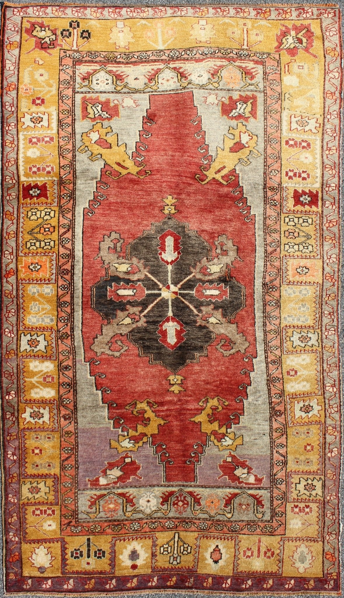 Turkish Antique Tribal Diamond Medallion Oushak Area Rug in Red and Gold Measures: 4'8 x 8'7 This beautiful Turkish Oushak is unique in its color palette. The center medallion features a combination of black, brown, gold, red and light ... - Keivan Woven ArtsEN - 112658 - 2699Rug