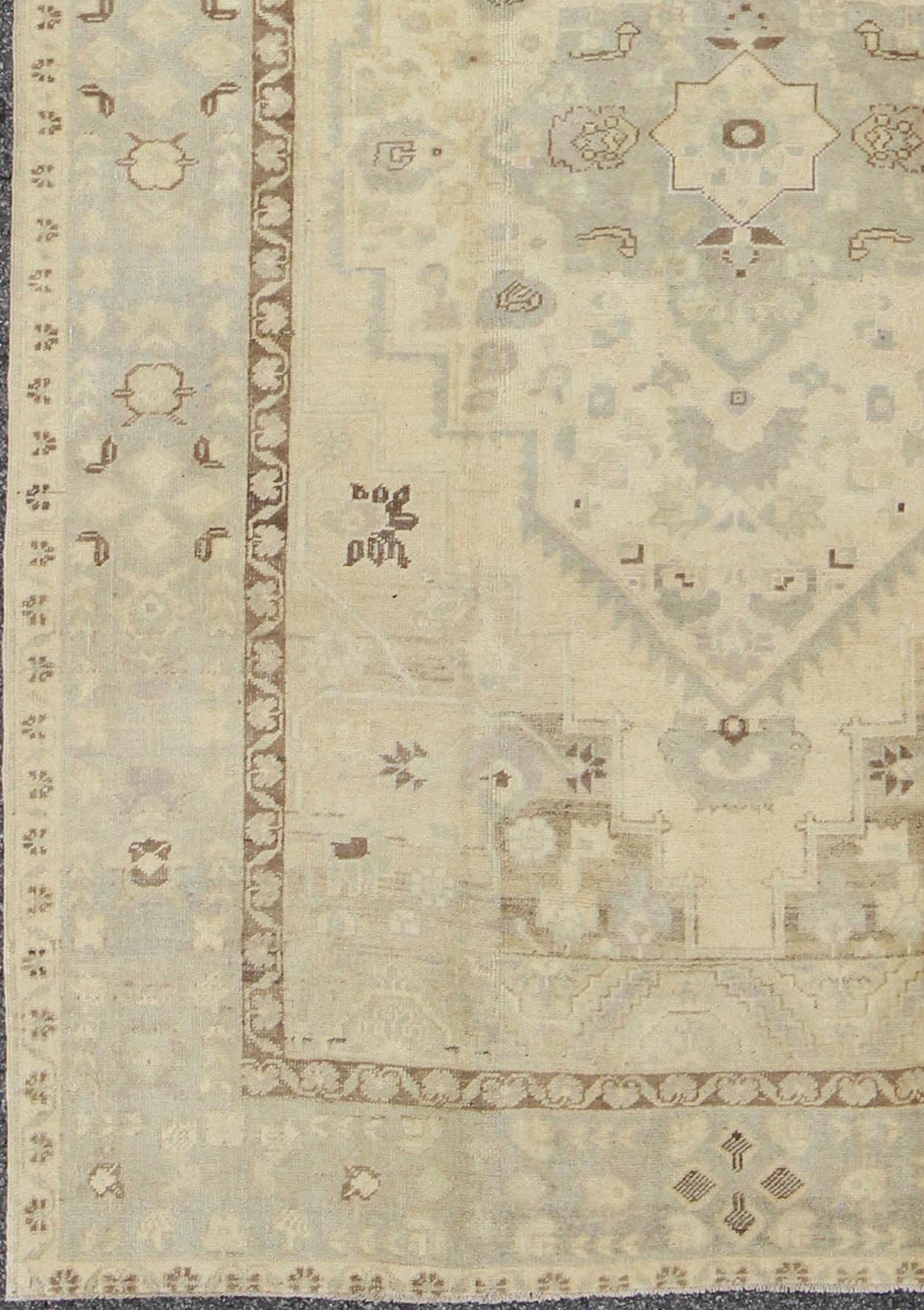Turkish Oushak This stunning Turkish Oushak displays a gray/blue border and taupe background with brown highlights. The bold geometric design is softened by the use of subdued and pale colors. Measures: 6'4 x 9'4. - Keivan Woven ArtsEN - 112721 - 4900Rug