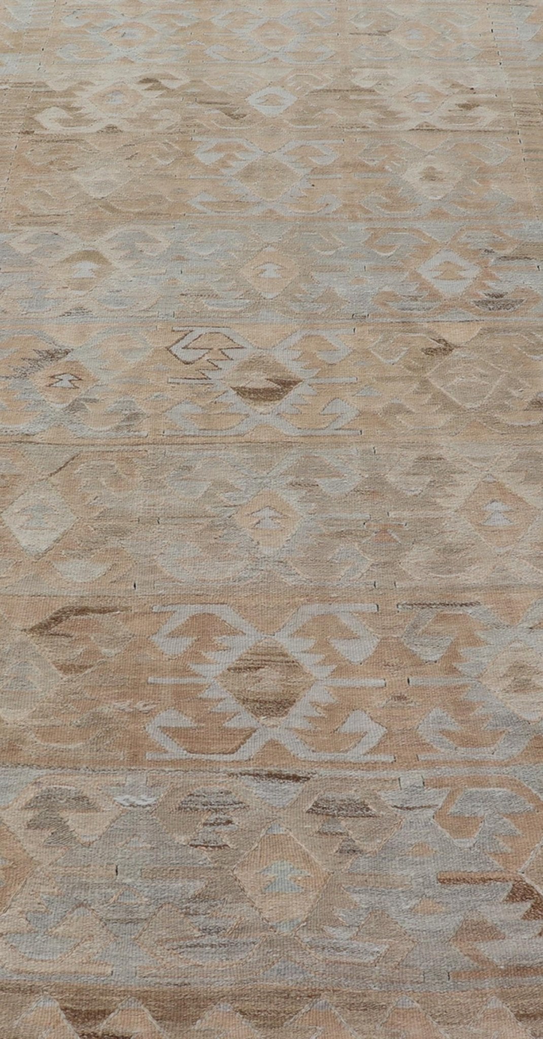 Gallery Turkish Vintage Flat - Weave Tribal Designed Kilim in Earthy Tones Measures: 5 x 10'1 This vintage Turkish flat weave Kilim features tribal relics and faded earthy neutrals. The repeating design covers the entire field of muted li... - Keivan Woven ArtsEN - 113 - 18782