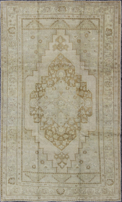 Vintage Turkish Oushak Rug Oushak rugs such as this vintage piece are highly decorative and desirable for their subduded and pale colors. The subdued color palette of soft gold, light brown, green, ivory and bone colors is enhanced by the partic... - Keivan Woven ArtsEN - 115378 - 3154Rug