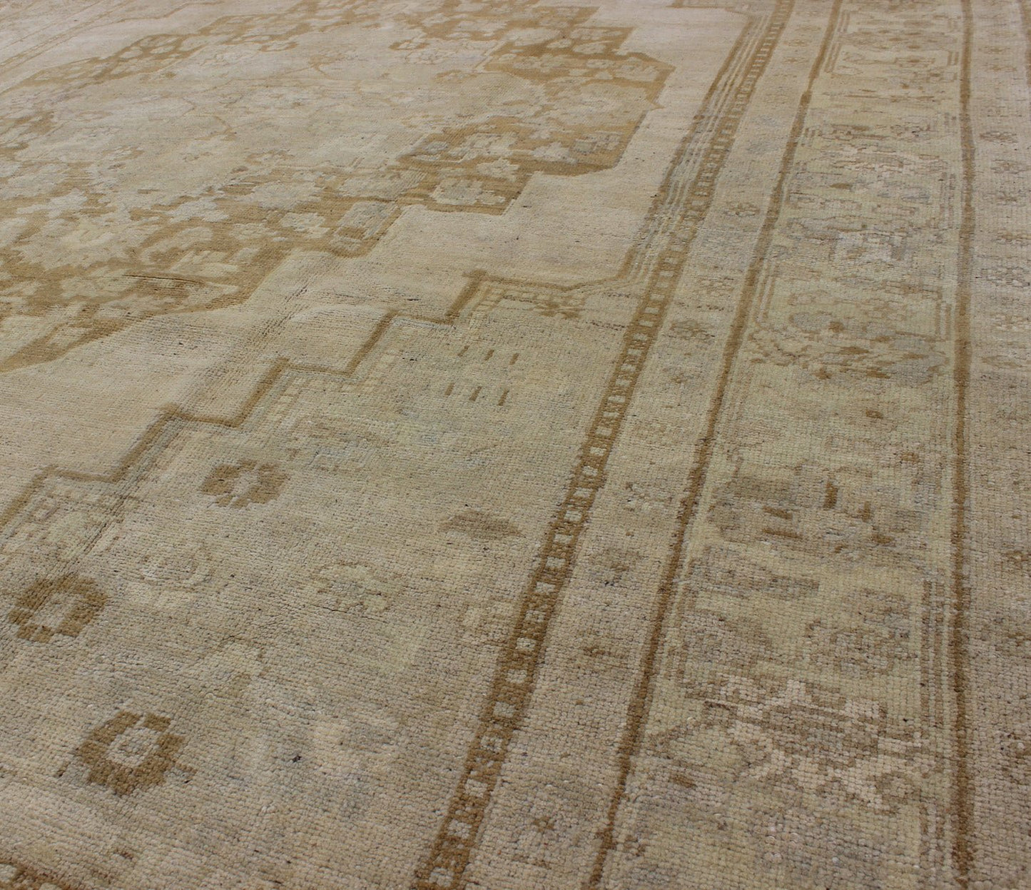 Vintage Turkish Oushak Rug Oushak rugs such as this vintage piece are highly decorative and desirable for their subduded and pale colors. The subdued color palette of soft gold, light brown, green, ivory and bone colors is enhanced by the partic... - Keivan Woven ArtsEN - 115378 - 3154Rug