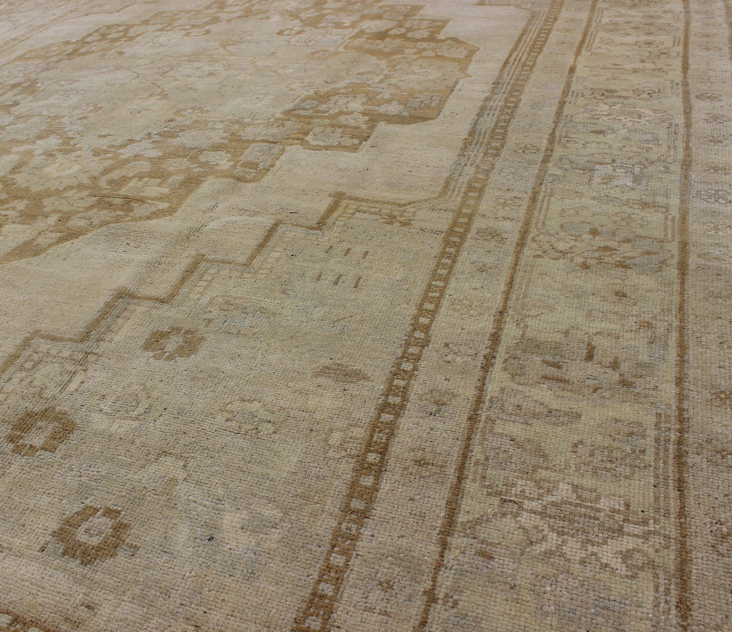 Vintage Turkish Oushak Rug Oushak rugs such as this vintage piece are highly decorative and desirable for their subduded and pale colors. The subdued color palette of soft gold, light brown, green, ivory and bone colors is enhanced by the partic... - Keivan Woven ArtsEN - 115378 - 3154Rug