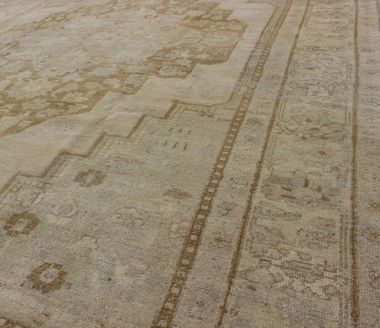 Vintage Turkish Oushak Rug Oushak rugs such as this vintage piece are highly decorative and desirable for their subduded and pale colors. The subdued color palette of soft gold, light brown, green, ivory and bone colors is enhanced by the partic... - Keivan Woven ArtsEN - 115378 - 3154Rug