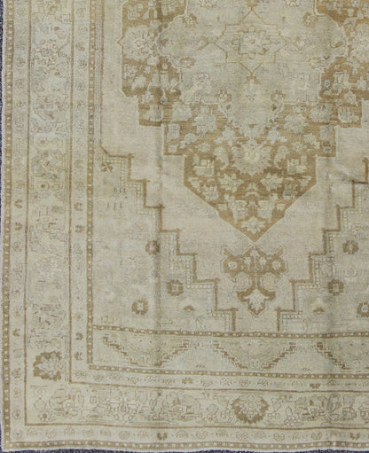 Vintage Turkish Oushak Rug Oushak rugs such as this vintage piece are highly decorative and desirable for their subduded and pale colors. The subdued color palette of soft gold, light brown, green, ivory and bone colors is enhanced by the partic... - Keivan Woven ArtsEN - 115378 - 3154Rug