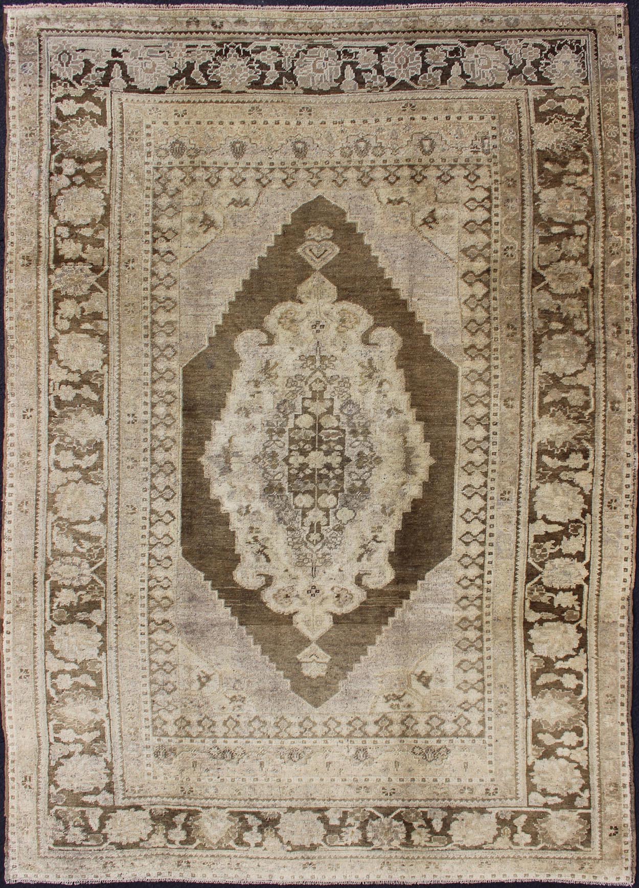 Vintage Turkish Oushak Rug This Turkish Oushak is set on taupe background with a medium brown colors. The border displays flower pattern with connecting vines. Measures: 5'8 x 8'3. - Keivan Woven ArtsEN - 115623 - 2101Rug