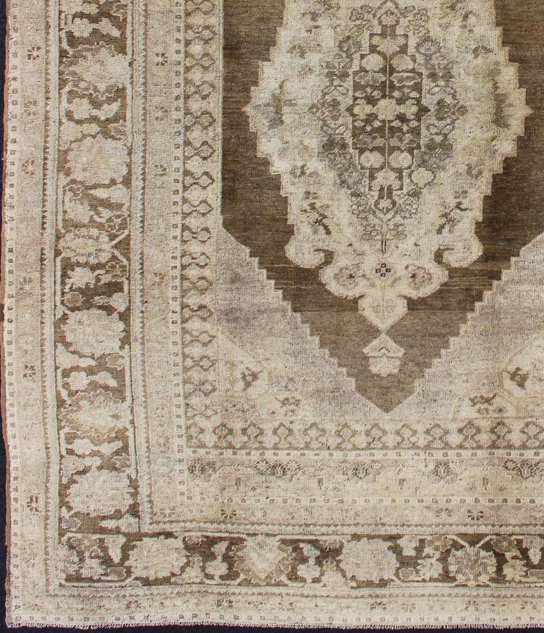 Vintage Turkish Oushak Rug This Turkish Oushak is set on taupe background with a medium brown colors. The border displays flower pattern with connecting vines. Measures: 5'8 x 8'3. - Keivan Woven ArtsEN - 115623 - 2101Rug