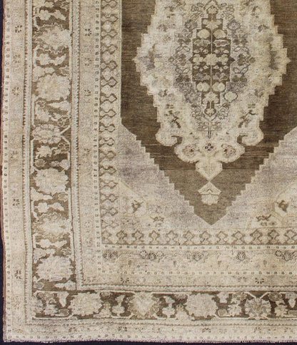 Vintage Turkish Oushak Rug This Turkish Oushak is set on taupe background with a medium brown colors. The border displays flower pattern with connecting vines. Measures: 5'8 x 8'3. - Keivan Woven ArtsEN - 115623 - 2101Rug