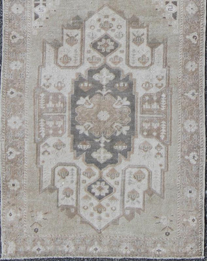 Turkish Oushak Runner with Central Medallion Design in Taupe, Charcoal and Gray kwarugs This Turkish vintage Oushak runner features a central medallion design as well as patterns of smaller botanical elements. Colors include various shades o... - Keivan Woven ArtsEN - 115826 - 2093Rug
