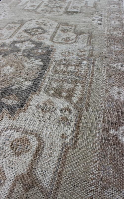 Turkish Oushak Runner with Central Medallion Design in Taupe, Charcoal and Gray kwarugs This Turkish vintage Oushak runner features a central medallion design as well as patterns of smaller botanical elements. Colors include various shades o... - Keivan Woven ArtsEN - 115826 - 2093Rug