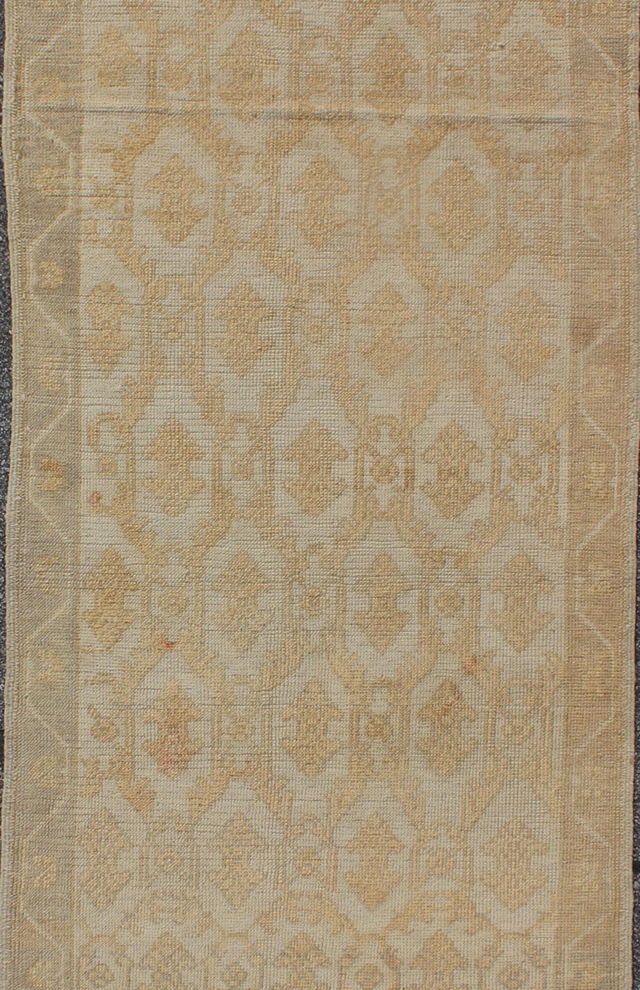 Muted Midcentury Turkish Oushak Runner with Latticework Design in Cream, yellow and taupe Measures: 3'3 x 8'7 Set on a cream - colored field with an all - over similarly - toned pattern, this beautiful midcentury Turkish Oushak rug (circa 1... - Keivan Woven ArtsEN - 115963 - 2077Rug