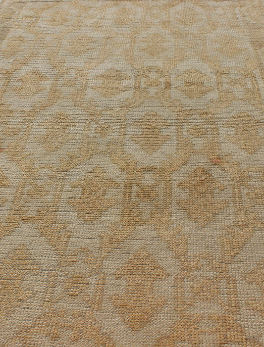 Muted Midcentury Turkish Oushak Runner with Latticework Design in Cream, yellow and taupe Measures: 3'3 x 8'7 Set on a cream - colored field with an all - over similarly - toned pattern, this beautiful midcentury Turkish Oushak rug (circa 1... - Keivan Woven ArtsEN - 115963 - 2077