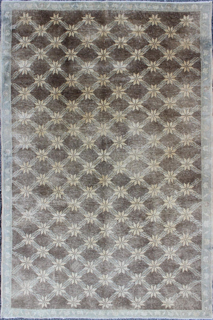 Midcentury Vintage Turkish Oushak Rug with Floral Latticework Pattern Measures: 5 x 7'10 The design of this beautiful vintage Oushak rug from mid - 20th century Turkey. The brown background is home to an all - over cream lattice design decor... - Keivan Woven ArtsEN - 115974 - 2071Rug