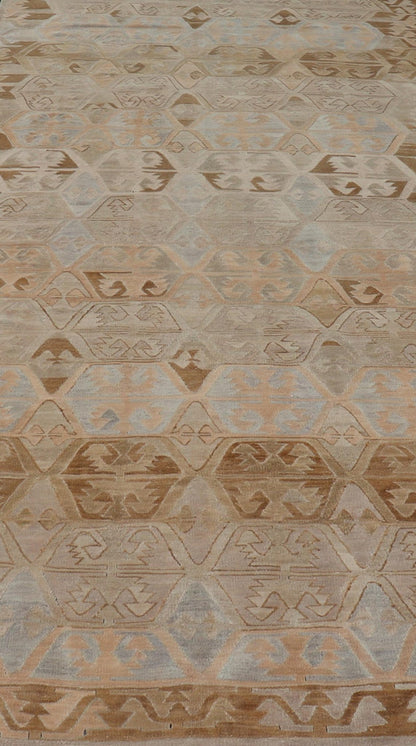 Vintage Hand - Woven Turkish Kilim Gallery Rug in Wool with Sub - Geometric Design This flat - weave tribal Turkish kilim has been hand - woven in wool. The rug features an all - over sub - geometric design, rendered in grays blues and earthy tones; making... - Keivan Woven ArtsEN - 122 - 19244