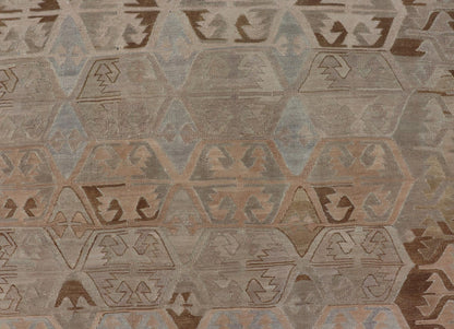Vintage Hand - Woven Turkish Kilim Gallery Rug in Wool with Sub - Geometric Design This flat - weave tribal Turkish kilim has been hand - woven in wool. The rug features an all - over sub - geometric design, rendered in grays blues and earthy tones; making... - Keivan Woven ArtsEN - 122 - 19244