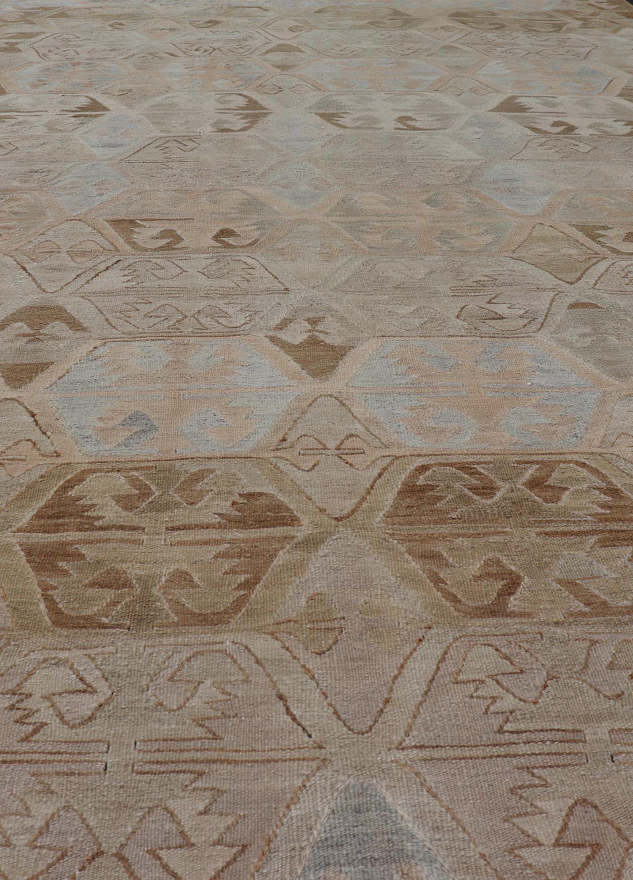 Vintage Hand - Woven Turkish Kilim Gallery Rug in Wool with Sub - Geometric Design This flat - weave tribal Turkish kilim has been hand - woven in wool. The rug features an all - over sub - geometric design, rendered in grays blues and earthy tones; making... - Keivan Woven ArtsEN - 122 - 19244