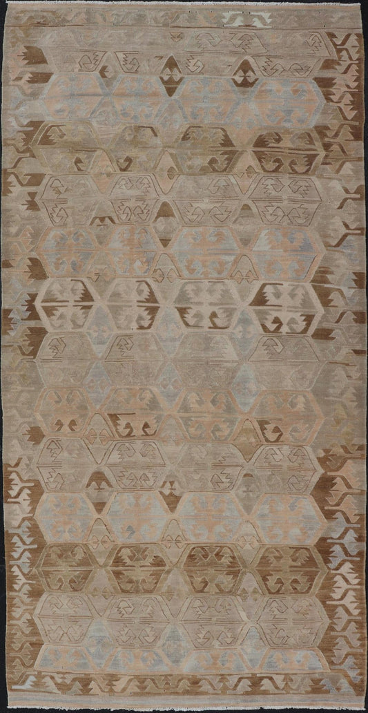 Vintage Hand - Woven Turkish Kilim Gallery Rug in Wool with Sub - Geometric Design This flat - weave tribal Turkish kilim has been hand - woven in wool. The rug features an all - over sub - geometric design, rendered in grays blues and earthy tones; making... - Keivan Woven ArtsEN - 122 - 19244